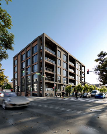 Front view of a multi-story building at a street corner with large windows and balconies.