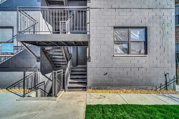 Front view of a building with metal exterior staircase.