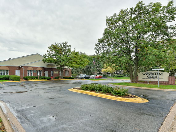 Front view of a single-story building with an entrance canopy.
