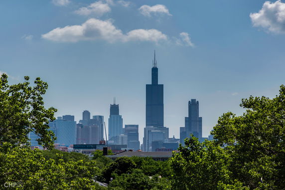 Panoramic view of a city skyline with prominent tall buildings.