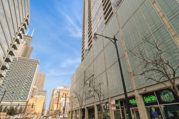 Front view of a multi-story commercial building with glass facade.