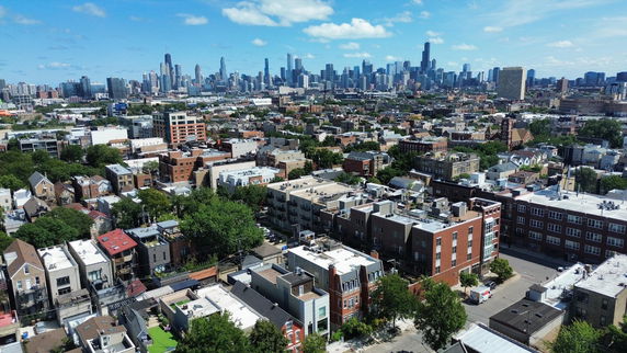 Panoramic view of urban landscape with buildings and city skyline in the background.