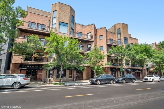 Front view of a multi-story commercial and residential building with a law office on the ground floor.