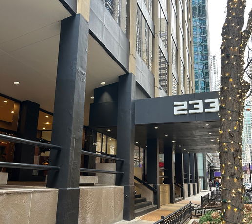 Front view of a multi-story commercial building entrance.