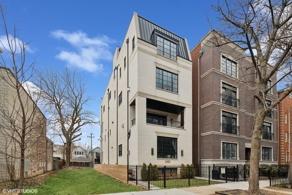 Front view of a multi-story building with a modern design.