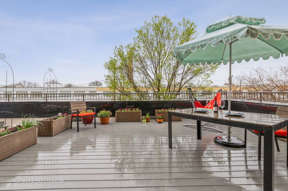 Rooftop with seating area and potted plants