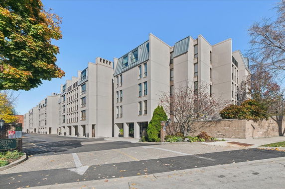 Front view of a multi-story residential building with a modern design.