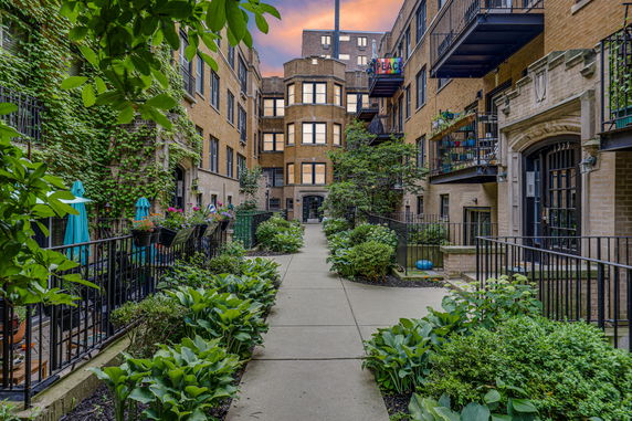 View of the courtyard between multi-story apartment buildings.