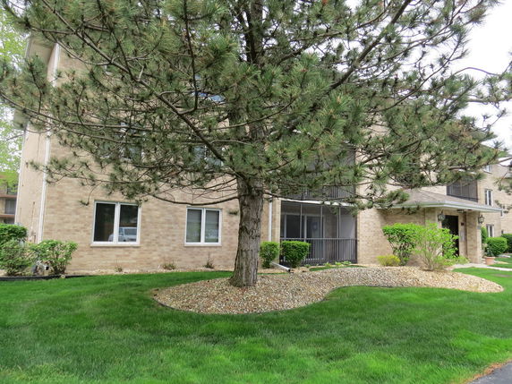 Front view of a multi-story brick building.