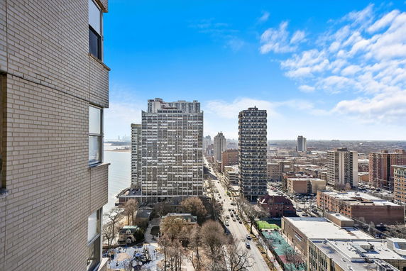 Panoramic view of a cityscape with tall residential buildings and streets.