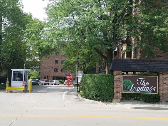 Front view of a brick building with signage reading 'The Landings'.