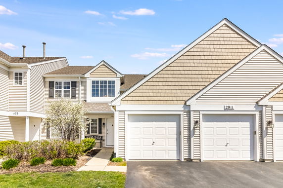Front view of a two-story house with a double garage.