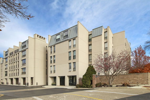 Front view of a multi-story residential building with modern design.