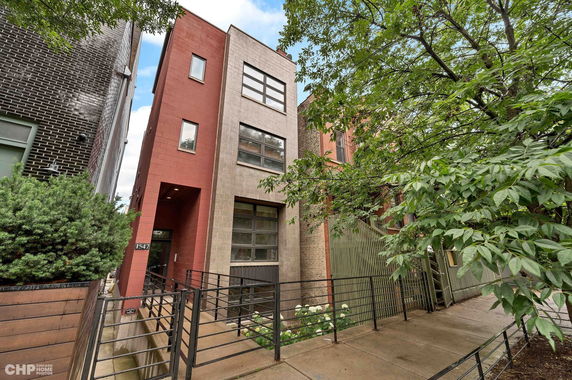 Front view of a multi-story residential building with a modern design.