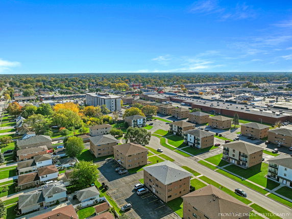 Panoramic view of a residential and commercial area with multiple buildings.