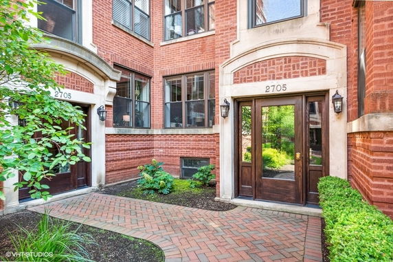 Front view of a brick building with two entrances numbered 2705.