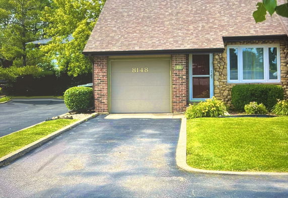 Front view of a single-story house with a garage.