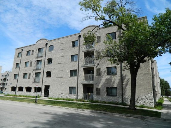 Front view of a multi-story apartment building.