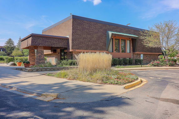 Front view of a brick building with a unique architectural design.