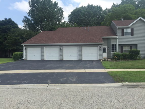 Front view of a house with multiple garages.