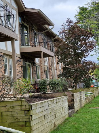 Exterior view of a multi-story brick building with balconies.