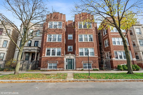 Front view of a multi-story brick apartment building