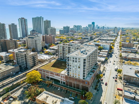 Aerial view of a cityscape with numerous buildings and roads.