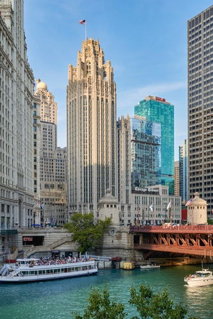 Front view of a tall, ornate skyscraper with Gothic architectural details.