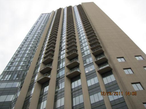 Front view of a tall multi-story building.