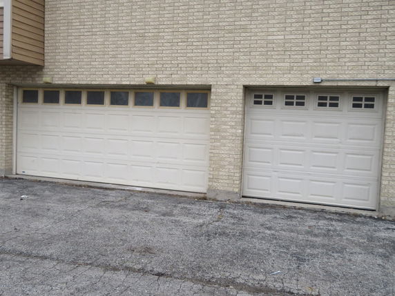Front view of a house with a double garage and brick exterior