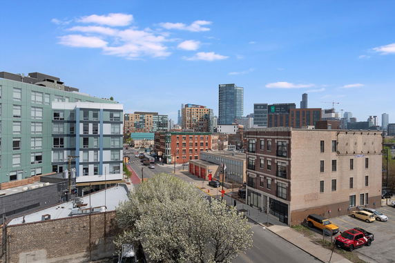 Panoramic view showing multiple buildings in an urban area.