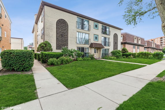 Front view of a multi-story apartment building.
