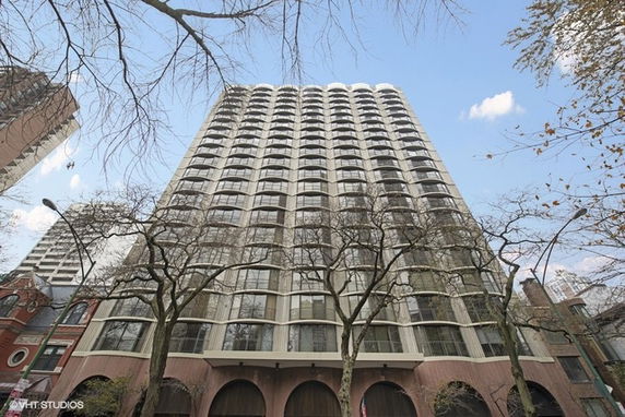 Front view of a high-rise building with a unique architectural design featuring curved elements.
