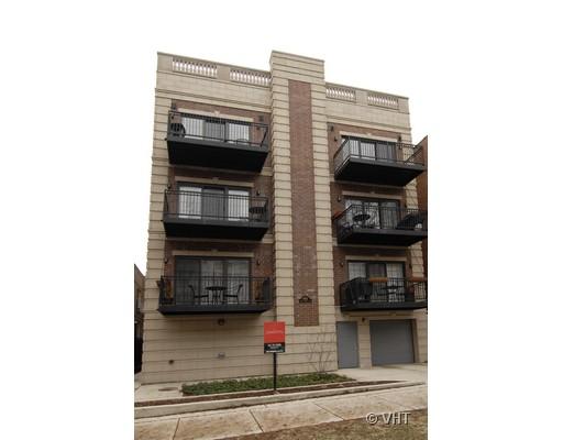 Front view of a multi-story apartment building with balconies.