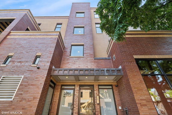 Front view of a multi-story brick building.
