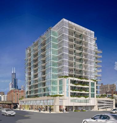 Front view of a modern multi-story glass and concrete building.