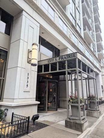 Front view of a multi-story building with a prominent entrance.