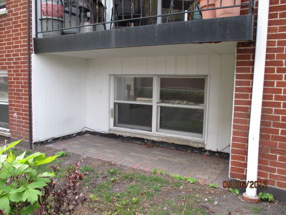 Front view of a low-level window on a brick building.