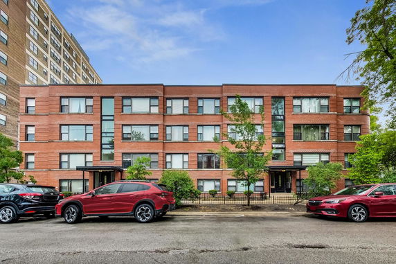 Front view of a multi-story brick residential building.