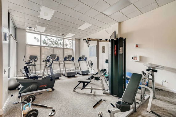 Indoor gym area with treadmills and exercise equipment.