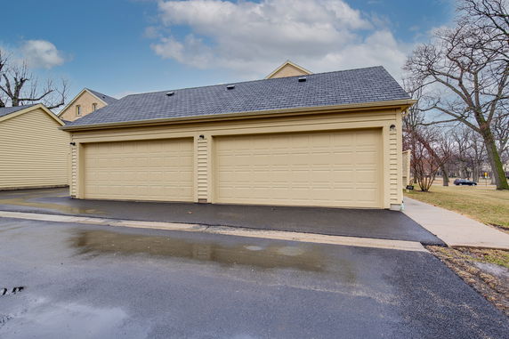 Front view of a two-car garage building structure.