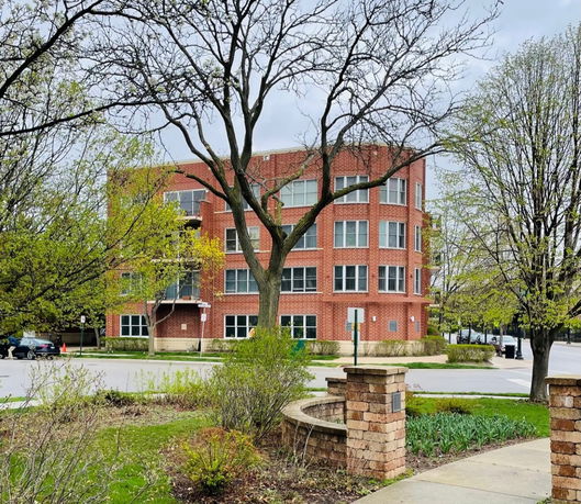 Front view of a multi-story brick building.