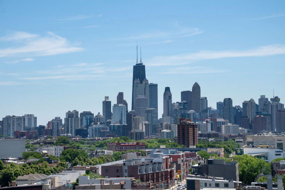 Panoramic view of a city skyline with tall buildings.