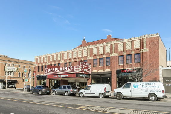 Front view of a theater building with a vintage facade.