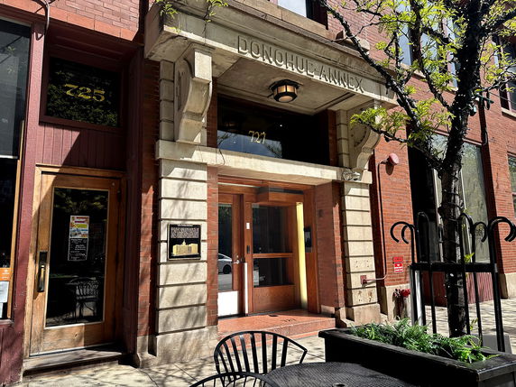 Front view of a brick building entrance labeled 'Donohue Annex'.