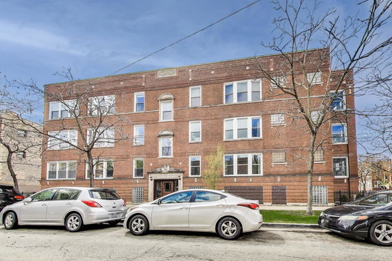 Front view of a three-story brick building.