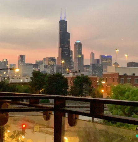 Panoramic view of a city skyline at dusk.