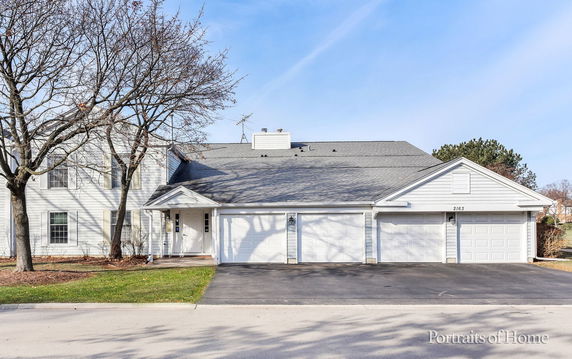 Front view of a house with a three-car garage.