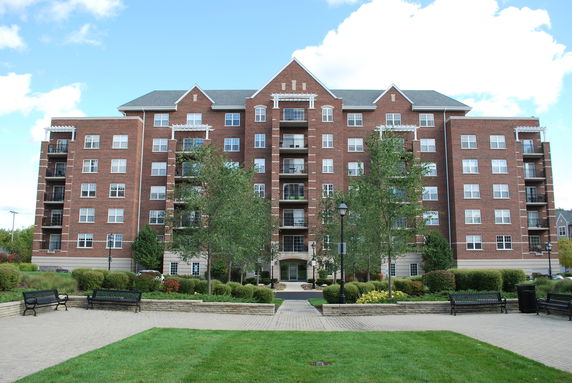 Front view of a multi-story brick apartment building