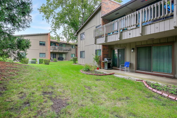 View of apartment buildings with balconies and glass sliding doors